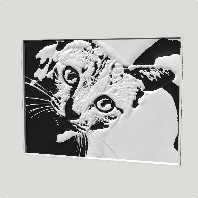 Relief of a kitten in two colours, white carving on a black backing