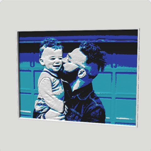 A sculpted relief of a dad kissing his toddler, in the Ocean palette